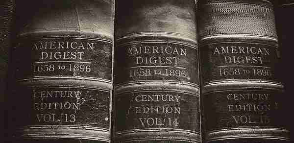 Law Books represent the daunting task of determining the proper legal form for a social enterprise | engageSPARK Social enterprise formation can be as daunting as these law books | engageSPARK